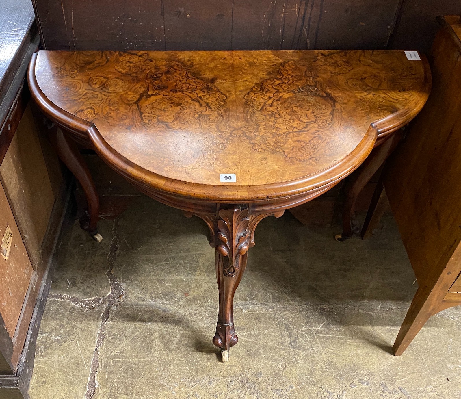 A Victorian figured walnut D shaped folding card table, width 100cm, depth 51cm, height 74cm